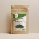 Sachet de superaliment spiruline paillettes Bioptimal présenté sur fond beige.