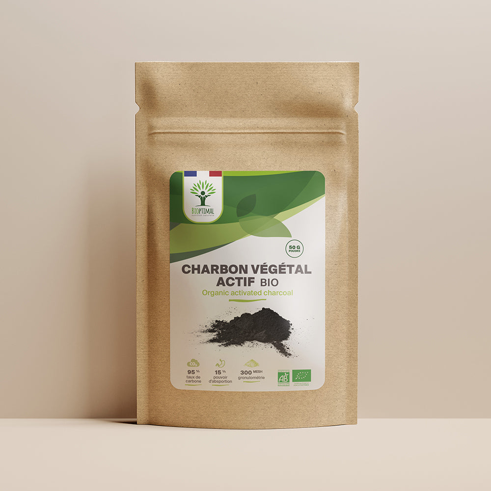 Sachet de superaliment charbon végétal actif Bioptimal présenté sur fond beige.